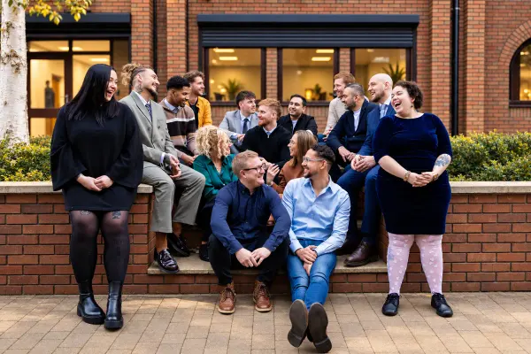 The Double Glazing Leads team sharing a laugh outside the office