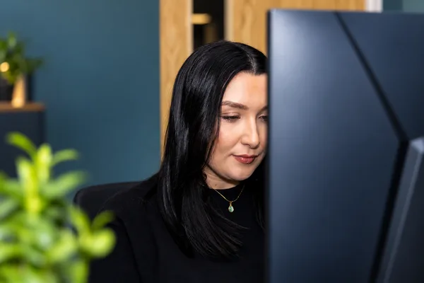 A Double Glazing Leads team member working at her office screen